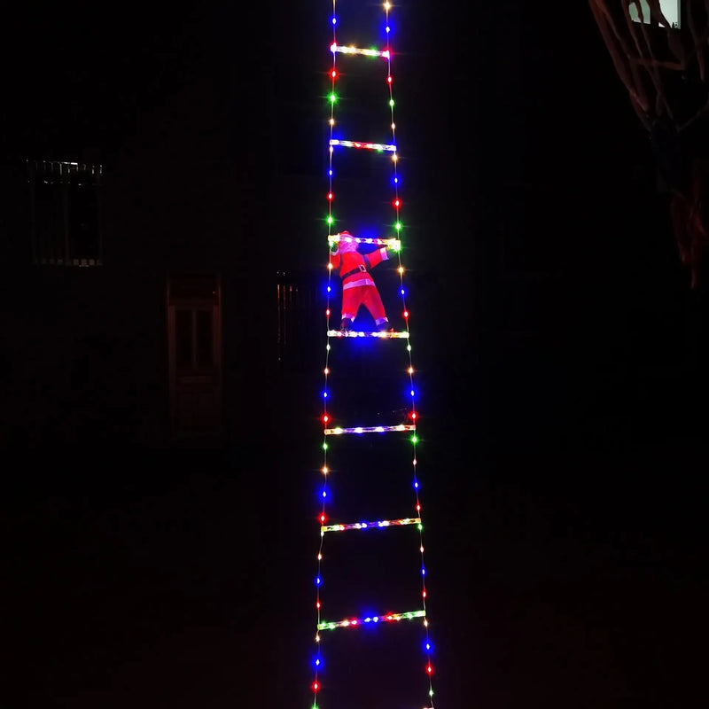 Holiday home entrance decorated with Santa and LED ladder.